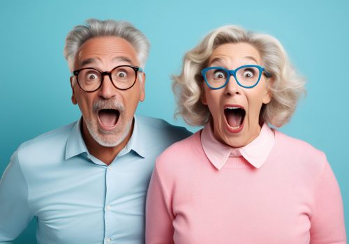 cheerful middle aged woman and her husband pensioner reacts on shocking news