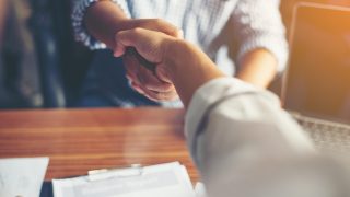 Business People Handshake Greeting Deal at work.